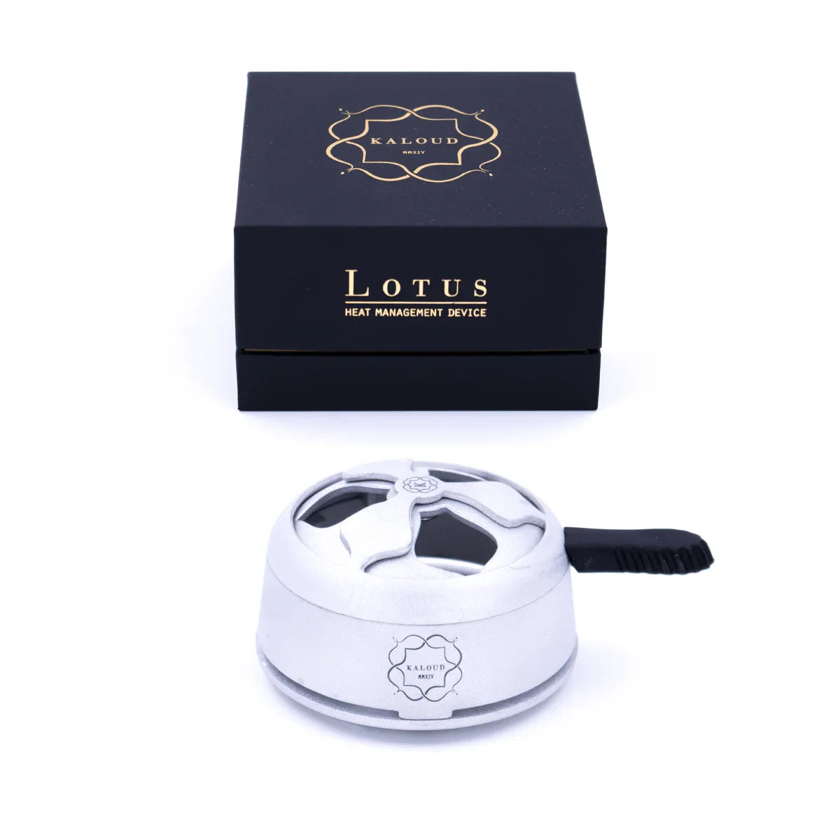 Kaloud Lotus heat management device in light silver with a black handle and flower-shaped openings, in front of the black box reading Lotus.