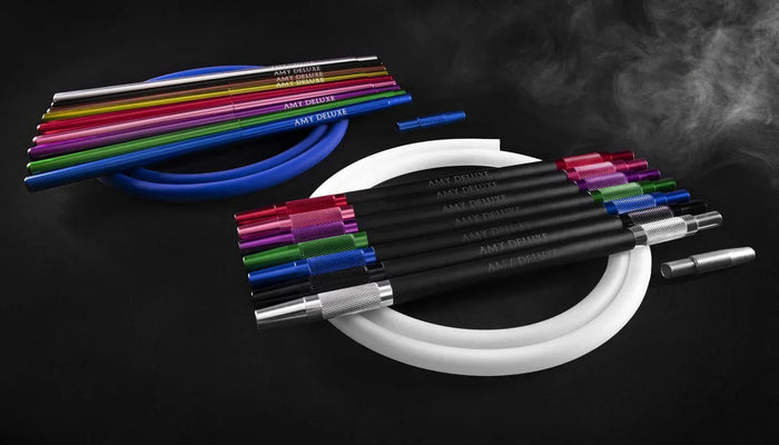 Colored silicone shisha hoses with aluminum handles in a fan on a dark surface.