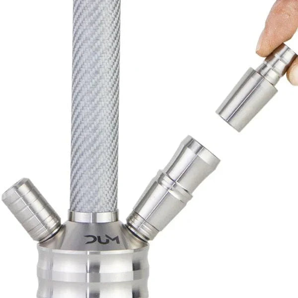 Hand placing a metal hose connector on the steel stem of a DUM hookah with a carbon pattern.