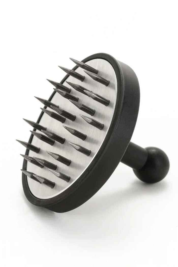 Round black foil poker with a head full of steel pins and a ball-shaped grip, to poke holes in one go.