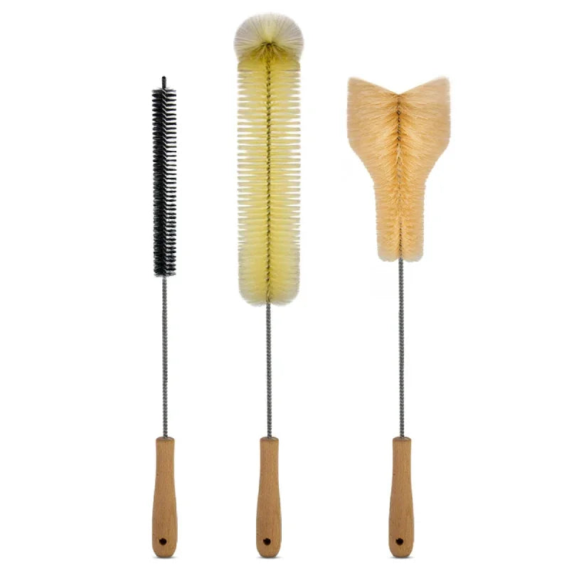 Three cleaning brushes with wooden handles and steel wire: a narrow black one, a yellow bottle brush and a wide flared base brush.