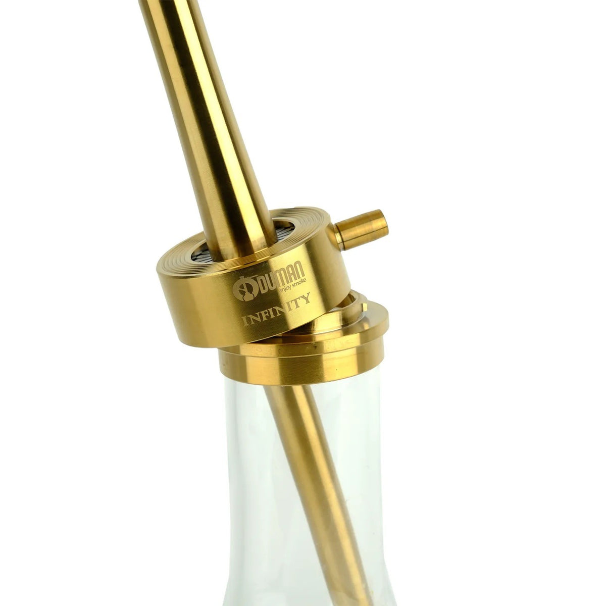 Gold block of the Oduman Infinity with its hose port above clear glass