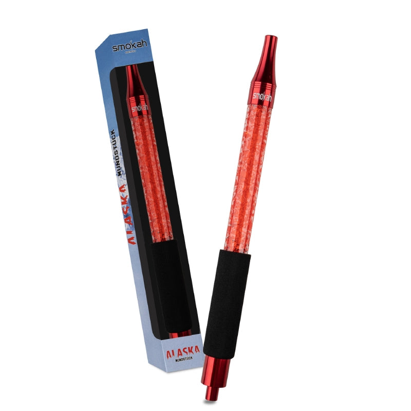 Red Smokah Ice mouthpiece Alaska with a glittering tube and a black foam rubber grip, at an angle in front of the blue box.